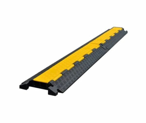 A close-up shot of a black and yellow cable ramp. You can hire cable ramp or yellow jacket from The Rock Factory in Auckland. This photo shows our hire cable protectors available for your event.