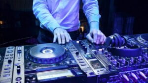 DJ using CDJ decks. Dj gear for hire. CDJ2000 nexus and DJM900 DJ Mixer.