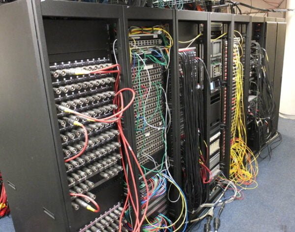 Stage Patch Technician Hire. Its the most important job on any gig. This photo shows a patch room at a venue / arena.
