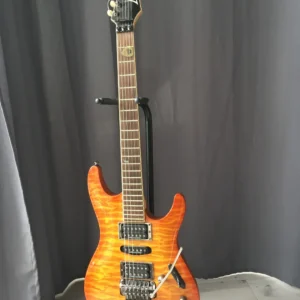 A close-up shot of a professional Ibanez S Series electric guitar with a flame maple top, highlighting its sleek body and design.
