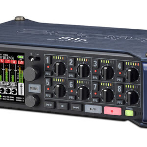 A close-up shot of the Zoom F8n multitrack field recorder's front panel and knobs, and preamp inputs on the side.